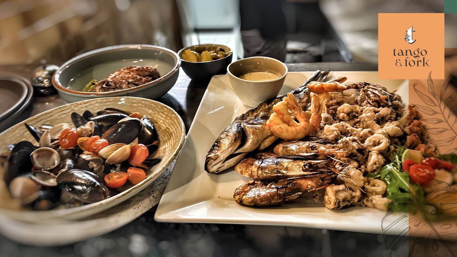 Seafood platter with grilled fish, prawns, calamari, and mussels served at Tango & Fork restaurant